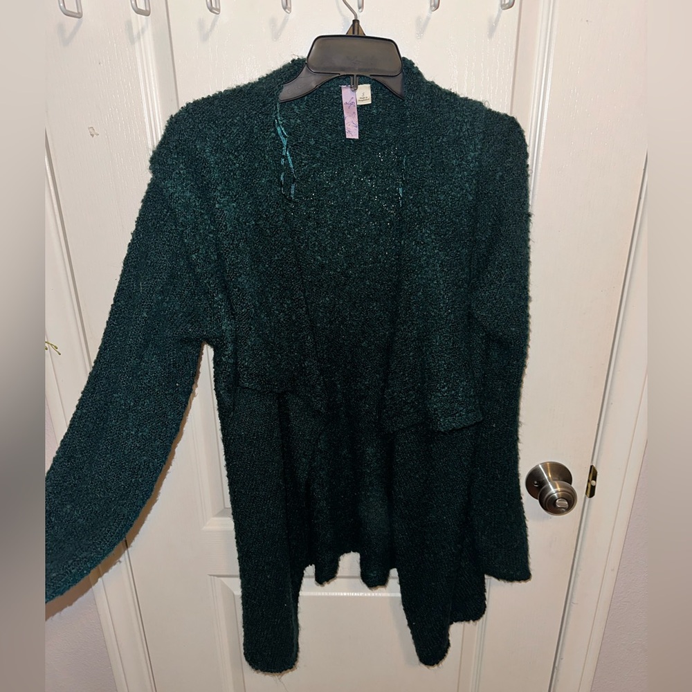 Francesca’s green cardigan